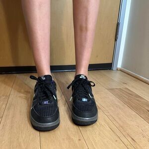 Nike Black and Purple Glow in the dark black AF1s Sneakers.